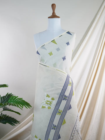 Cotton Woven with care in the looms of West Bengal, this 100% pure cotton saree blends everyday comfort with understated elegance. Fine zari floral designs shimmer softly against the breathable fabric, while the small border adds a touch of refinement. Lightweight and timeless, it’s perfect for summer gatherings and quiet celebrations Vathapi - Handloom Cotton Saree - Manoranjitham Weaves - Handloom Store