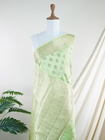 Chiniya Silk A masterpiece in 100% Pure Silk , this Peach saree adorned with Gold and Silver Zari Buttas patterns exudes regal charm. Perfect for the modern bride who cherishes tradition. Himadri - Manoranjitham Weaves - Handloom Store