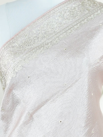 Tissue This semi-crush tissue saree from Varanasi radiates subtle elegance with its fine zari detailing and delicate embroidery. The fluid drape and medium weight lend it a graceful fall, ideal for refined gatherings and celebrations. A powerloom weave crafted with care, it offers timeless appeal in every pleat. Yamana - Semi Silk Saree - Manoranjitham Weaves - Handloom Store