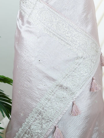Tissue This semi-crush tissue saree from Varanasi radiates subtle elegance with its fine zari detailing and delicate embroidery. The fluid drape and medium weight lend it a graceful fall, ideal for refined gatherings and celebrations. A powerloom weave crafted with care, it offers timeless appeal in every pleat. Yamana - Semi Silk Saree - Manoranjitham Weaves - Handloom Store