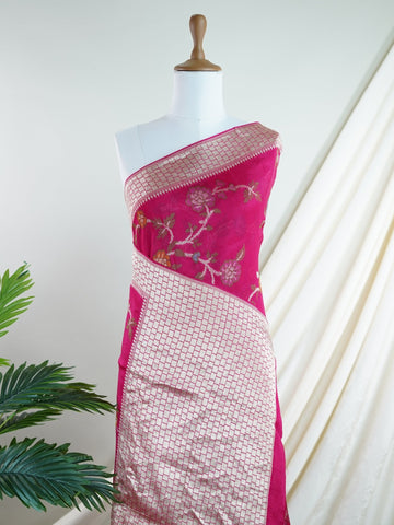 Georgette This Tussar Georgette saree from Varanasi brings together the textured richness of tussar silk with the fluid grace of georgette. Woven on a powerloom, it drapes light and airy, perfect for effortless elegance. Ideal for both day events and evening gatherings, it reflects quiet sophistication with a modern twist on tradition. Yashodhara - Georgette Saree | Handwoven | Varanasi - Manoranjitham Weaves - Handloom Store
